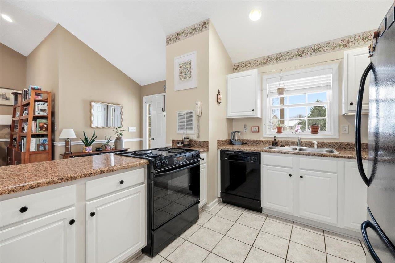41 Long Bow Road Waynesboro, VA 22980 - Photo 15 of 45 a kitchen with stainless steel appliances granite countertop a stove a sink and a refrigerator