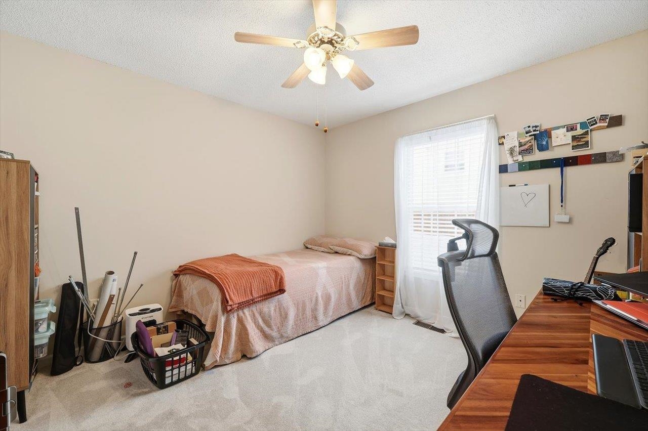 41 Long Bow Road Waynesboro, VA 22980 - Photo 24 of 45 a bedroom with bed and a chandelier