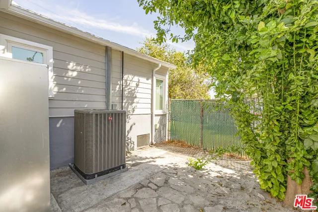 a view of a kitchen with wooden floor and staircase