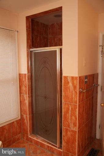5876 Pimlico Road Baltimore, MD 21209 - Photo 14 of 29 a bathroom with a shower