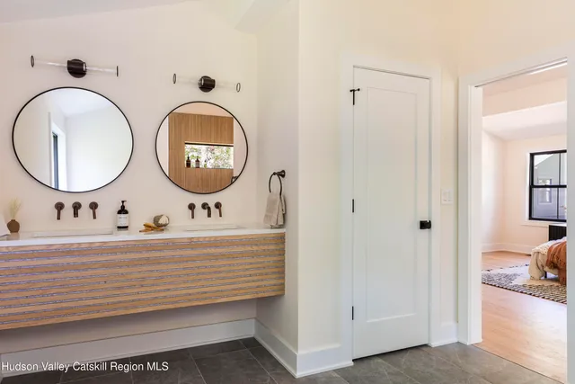 a bathroom with a sink and a window