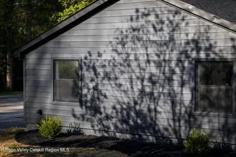 an empty room with windows and entrance