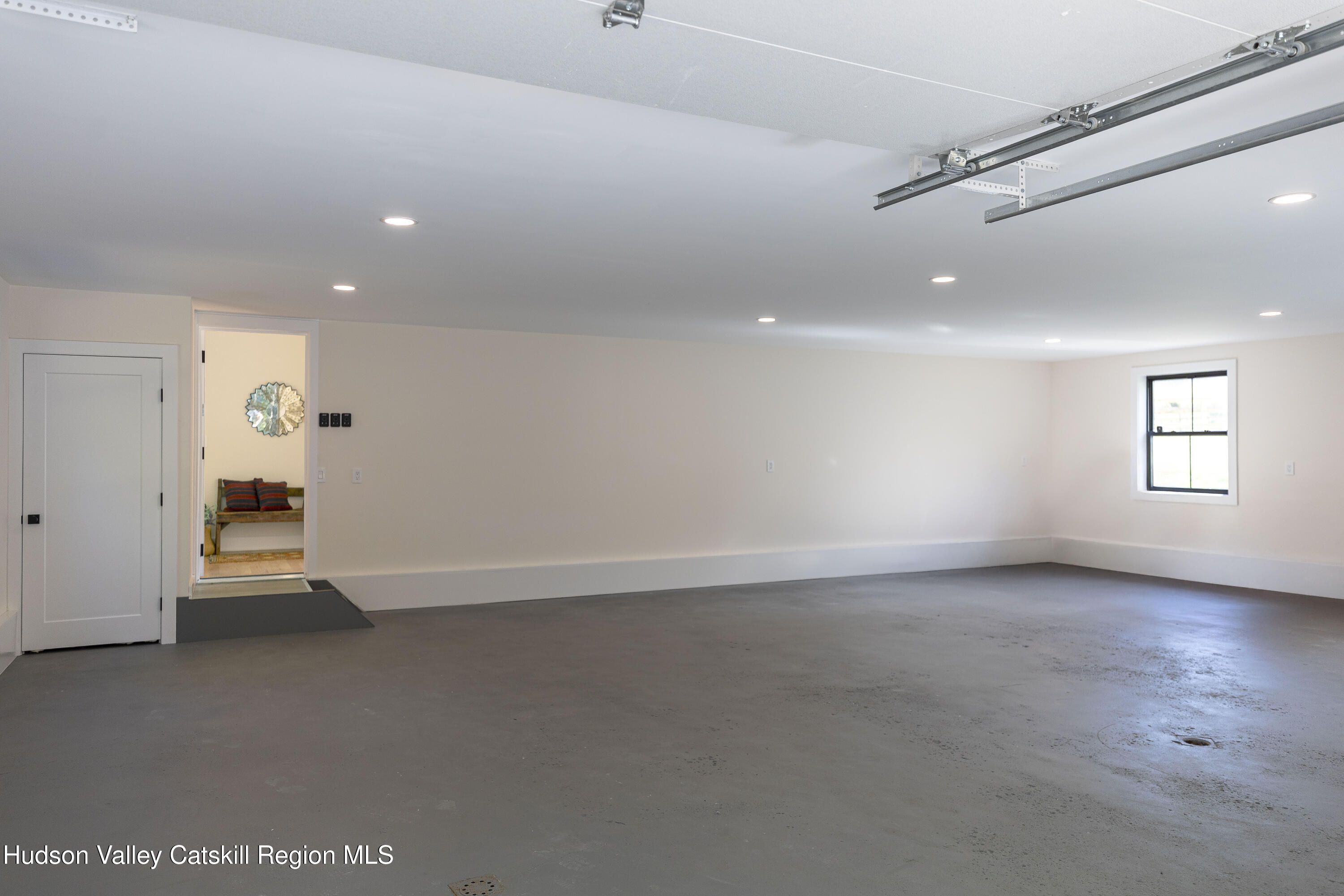 119 Mt Laurel Road Kerhonkson, NY 12446 - Photo 31 of 37 an empty room with windows and entrance