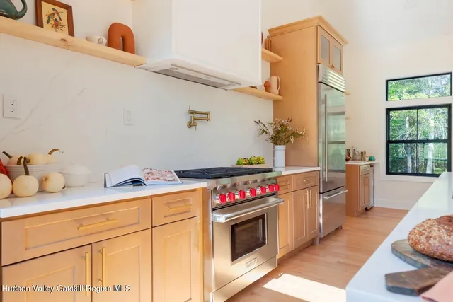 a kitchen with a stove and cabinets