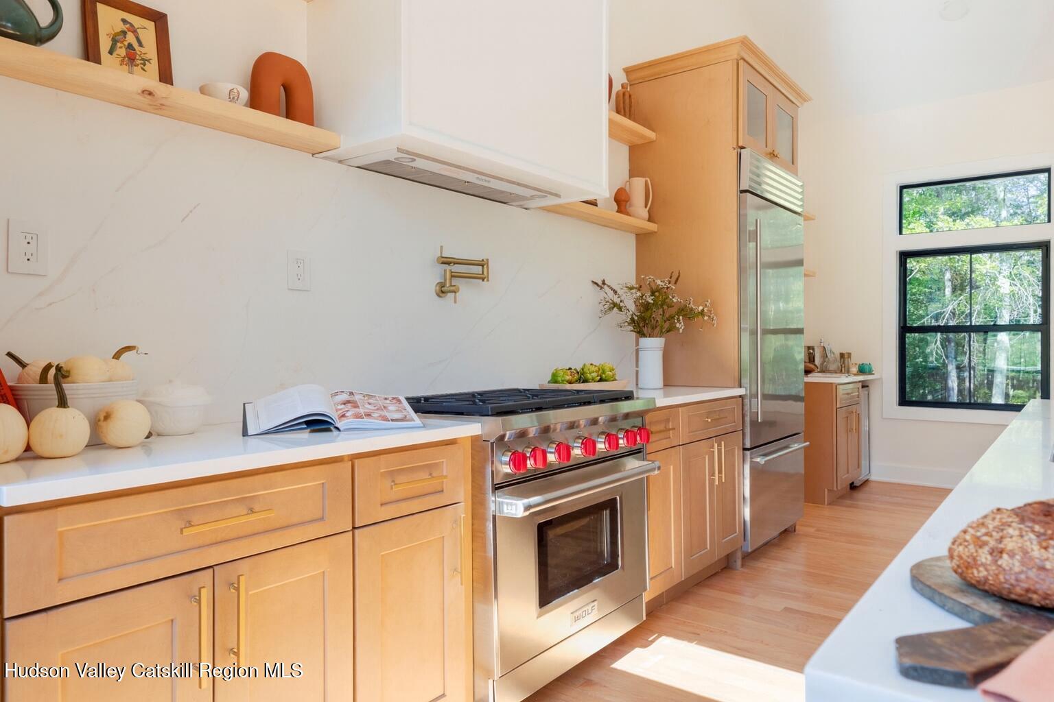 119 Mt Laurel Road Kerhonkson, NY 12446 - Photo 6 of 37 a kitchen with a stove and cabinets