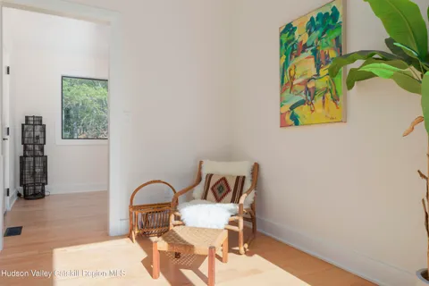 a view of a bedroom with a bed and furniture