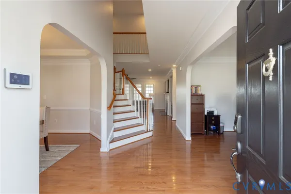 a living room with fireplace furniture and a wooden floor