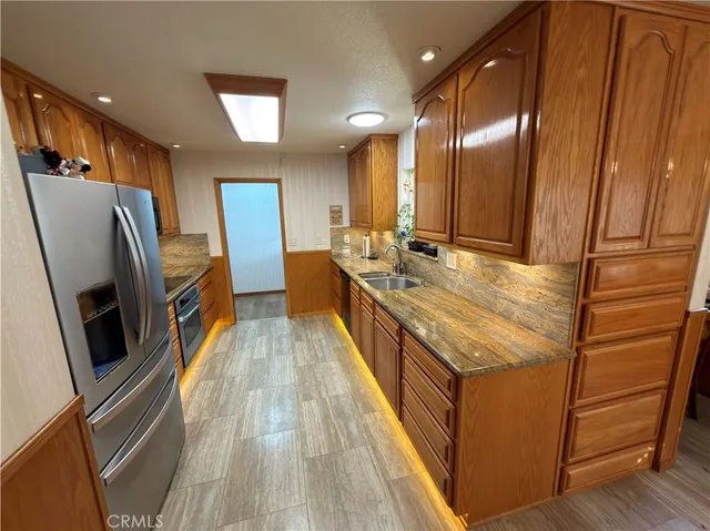 a bathroom with sink a toilet a mirror and vanity