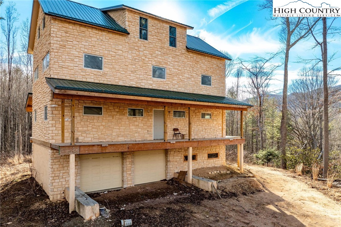 a front view of a house with parking space