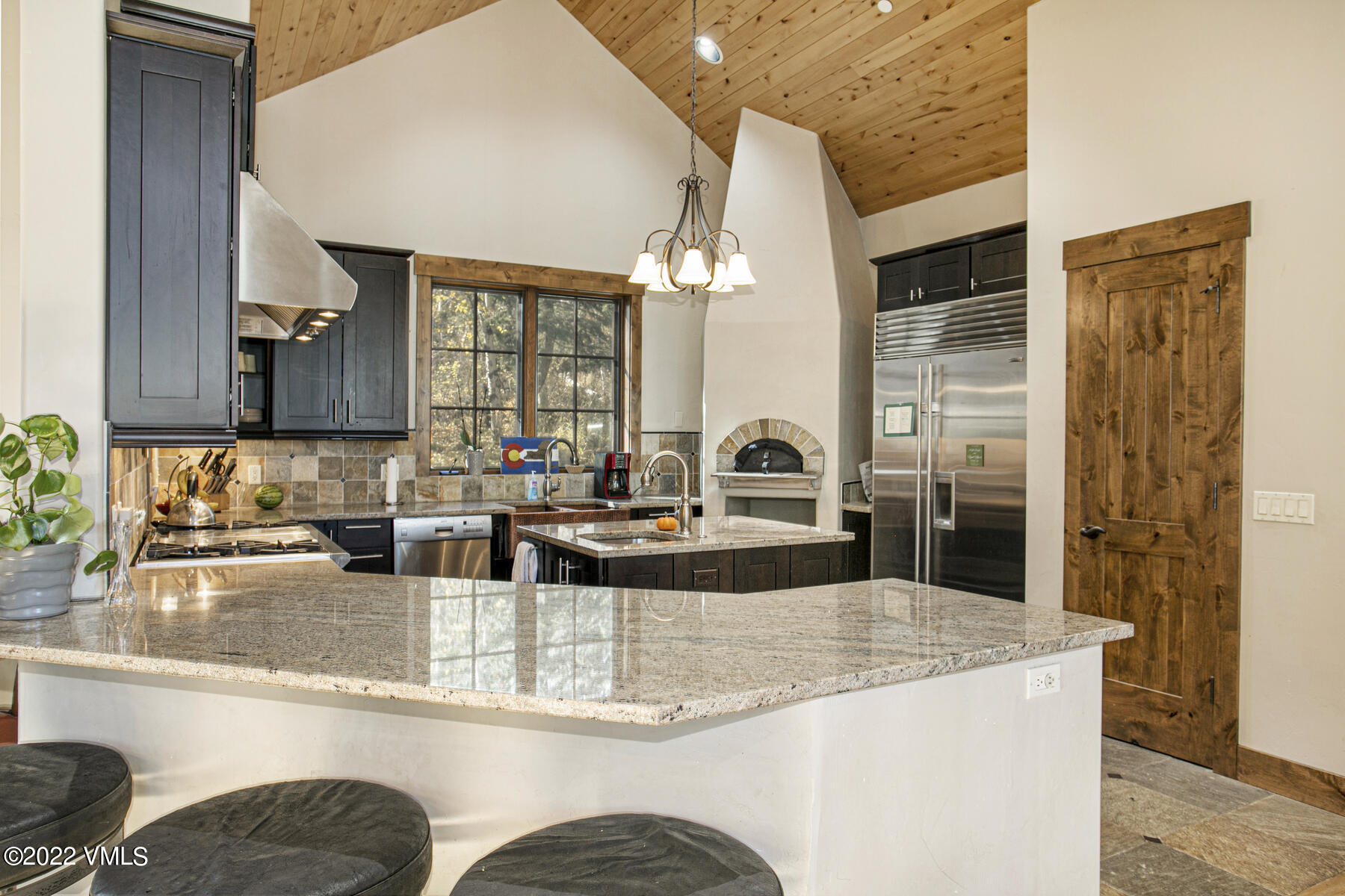 400 Red Draw Edwards, CO 81632 - Photo 11 of 49 a view of a kitchen with kitchen island granite countertop a sink and a refrigerator