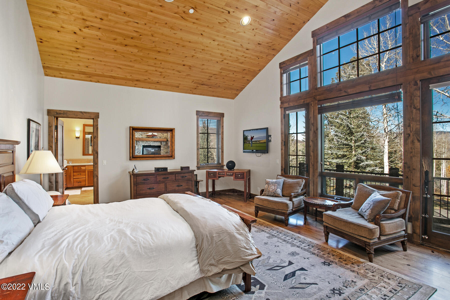 400 Red Draw Edwards, CO 81632 - Photo 16 of 49 a spacious bedroom with a bed a table and a large window