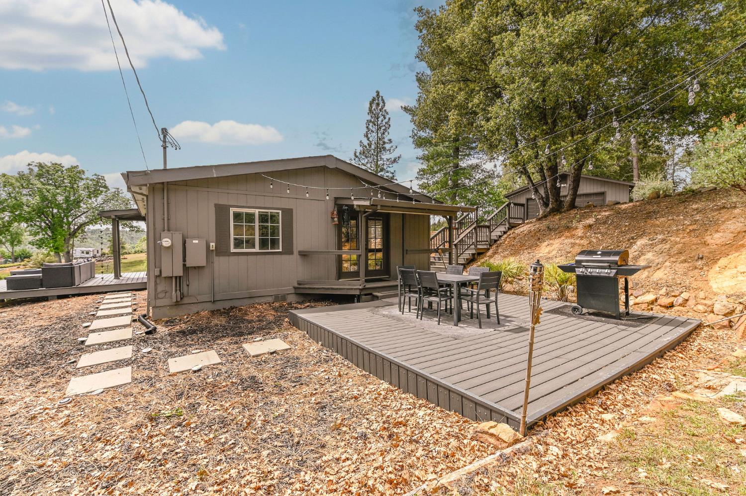 5695 Old Emigrant Trail Mountain Ranch, CA 95246 - Photo 43 of 79 a front view of a house with a yard