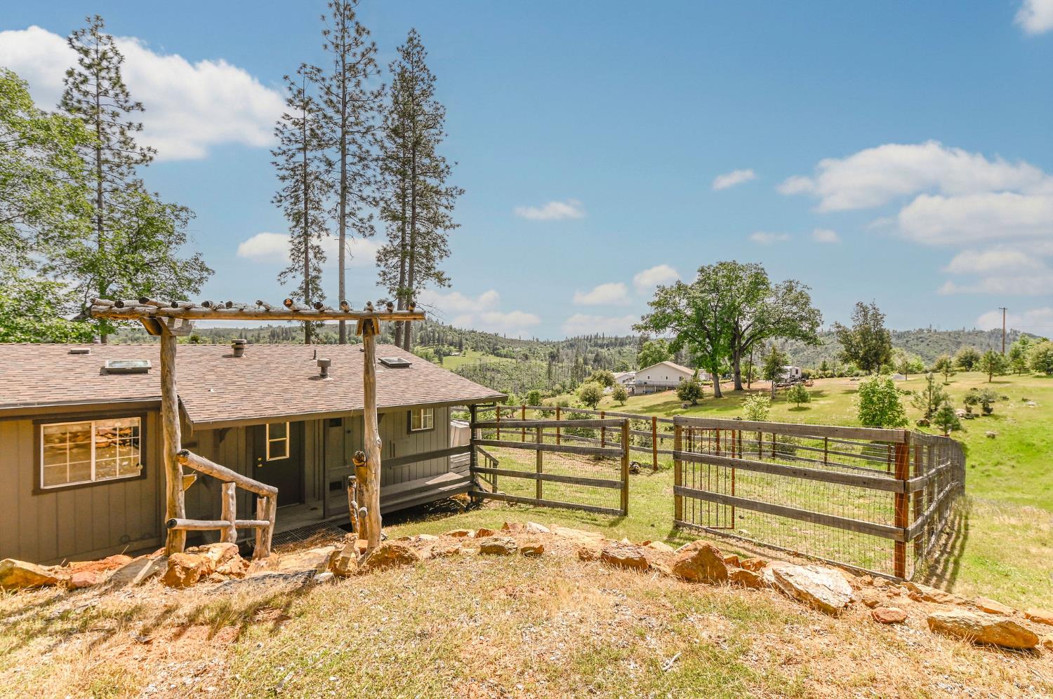 5695 Old Emigrant Trail Mountain Ranch, CA 95246 - Photo 54 of 79 a view of a terrace with a bench
