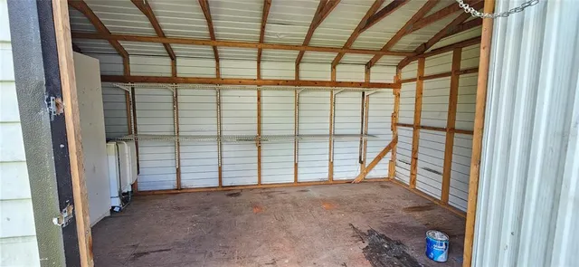 a view of empty room with floor to ceiling window