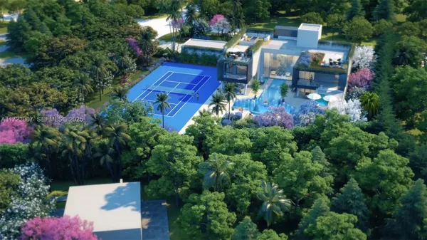 an aerial view of a house with yard swimming pool and outdoor seating