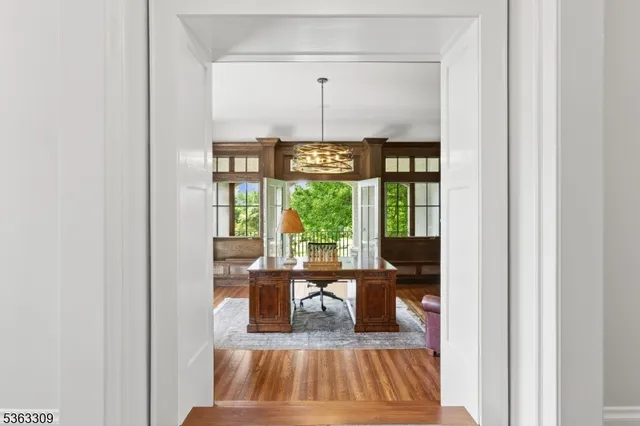 a view of a living room with furniture and a window
