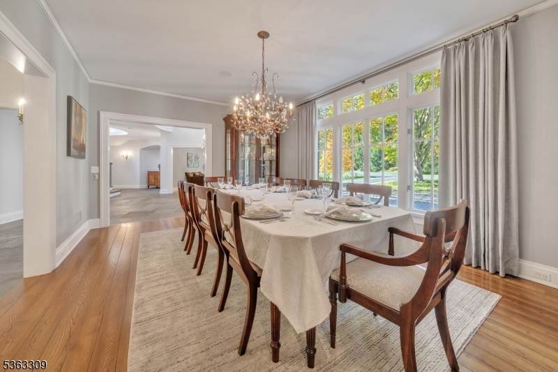211 Private Road Bernardsville, NJ 07924 - Photo 20 of 50 a dining room with furniture a chandelier and wooden floor