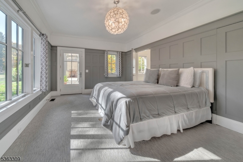 211 Private Road Bernardsville, NJ 07924 - Photo 22 of 50 a spacious bedroom with a bed and a large window