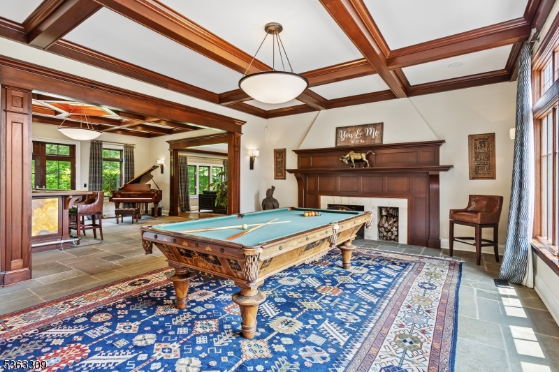 211 Private Road Bernardsville, NJ 07924 - Photo 23 of 50 a living room with furniture a flat screen tv and a table