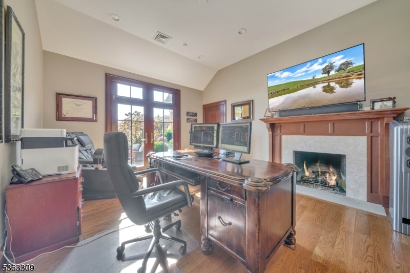 211 Private Road Bernardsville, NJ 07924 - Photo 30 of 50 a living room with furniture a fireplace and a flat screen tv