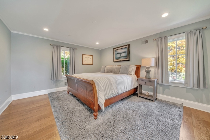 211 Private Road Bernardsville, NJ 07924 - Photo 31 of 50 a bedroom with a bed lamp and windows