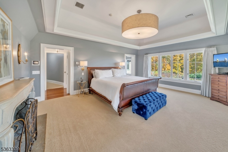 211 Private Road Bernardsville, NJ 07924 - Photo 33 of 50 a spacious bedroom with a bed and a large window