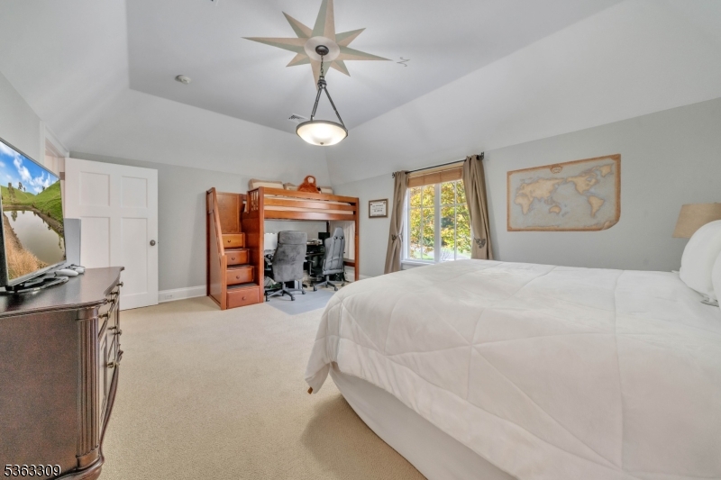 211 Private Road Bernardsville, NJ 07924 - Photo 38 of 50 a bedroom with a bed and a flat screen tv