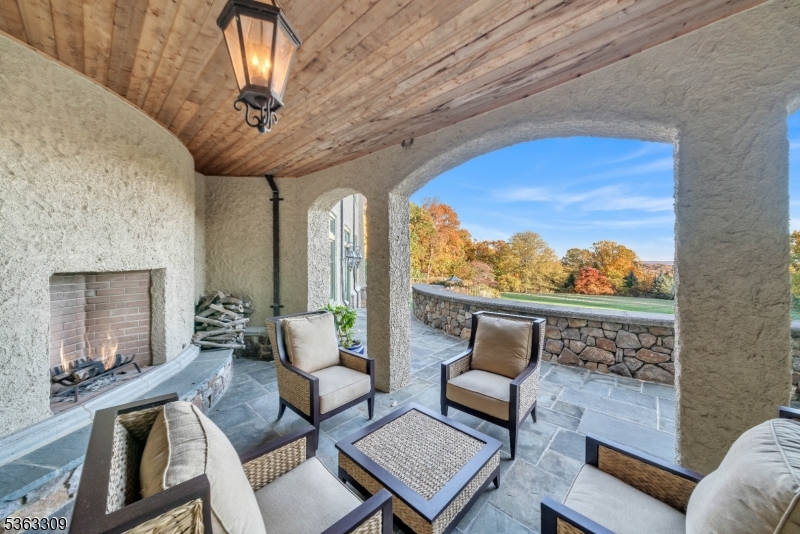 211 Private Road Bernardsville, NJ 07924 - Photo 39 of 50 a living room with furniture and a floor to ceiling window