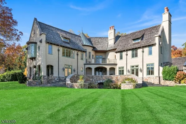 a front view of house with yard and outdoor seating