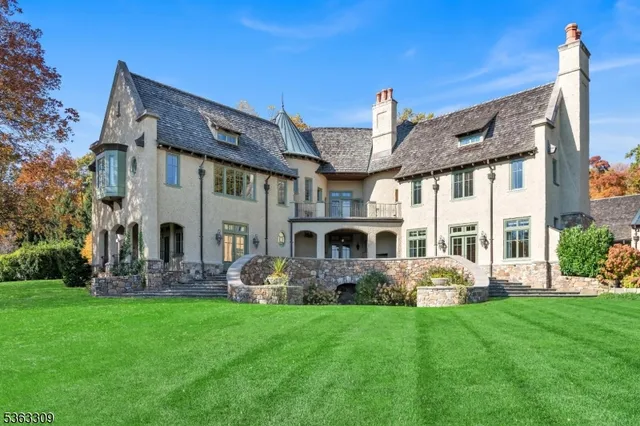 a front view of house with yard and outdoor seating