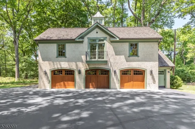 a kitchen with kitchen island granite countertop a sink cabinets and refrigerator