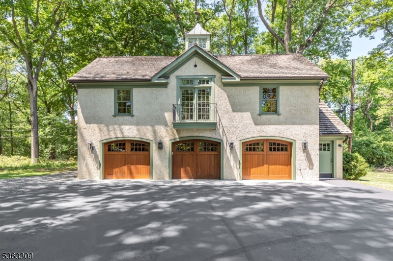 211 Private Road Bernardsville, NJ 07924 - Photo 47 of 50 a front view of a house with a yard and garage