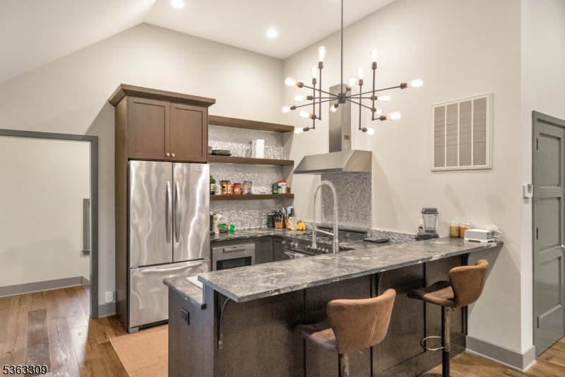 211 Private Road Bernardsville, NJ 07924 - Photo 48 of 50 a kitchen with kitchen island granite countertop a sink cabinets and refrigerator