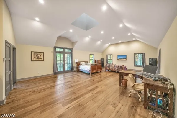 an aerial view of residential house with trees all around