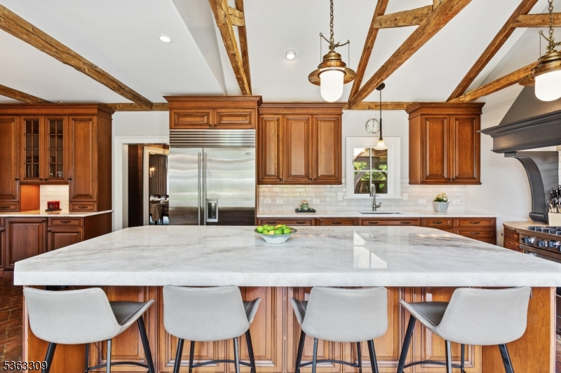 211 Private Road Bernardsville, NJ 07924 - Photo 10 of 50 a kitchen with a table chairs sink and cabinets