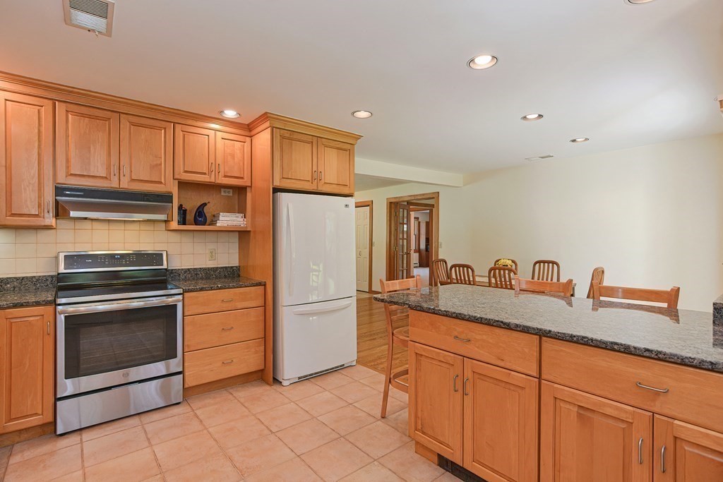110 Richard Road Holliston, MA 01746 - Photo 16 of 41 a kitchen with granite countertop cabinets stainless steel appliances and a sink