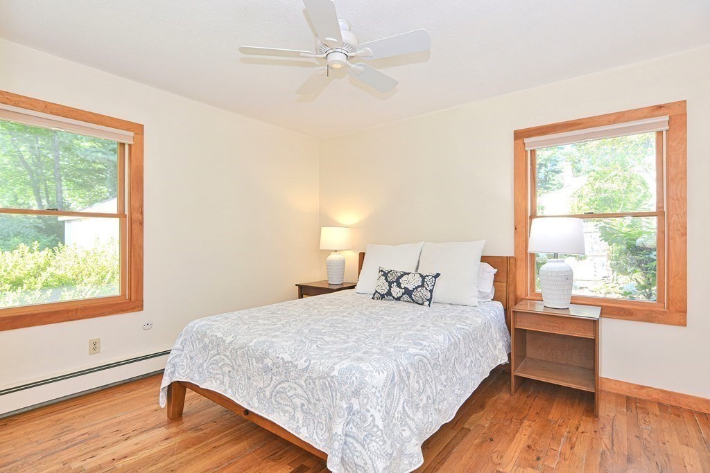 110 Richard Road Holliston, MA 01746 - Photo 28 of 41 a bedroom with a large bed and a large window