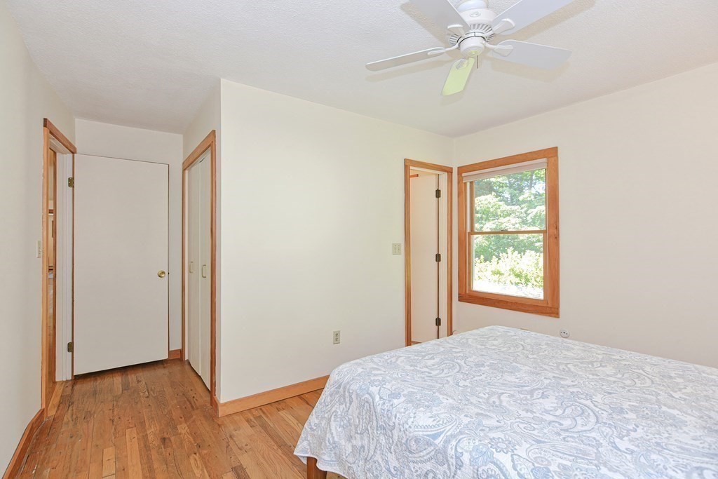 110 Richard Road Holliston, MA 01746 - Photo 30 of 41 a view of a bedroom with wooden floor and a window