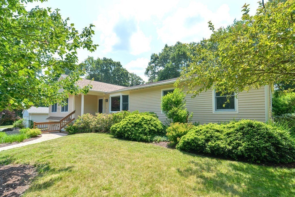 110 Richard Road Holliston, MA 01746 - Photo 3 of 41 a view of a house with a yard and potted plants