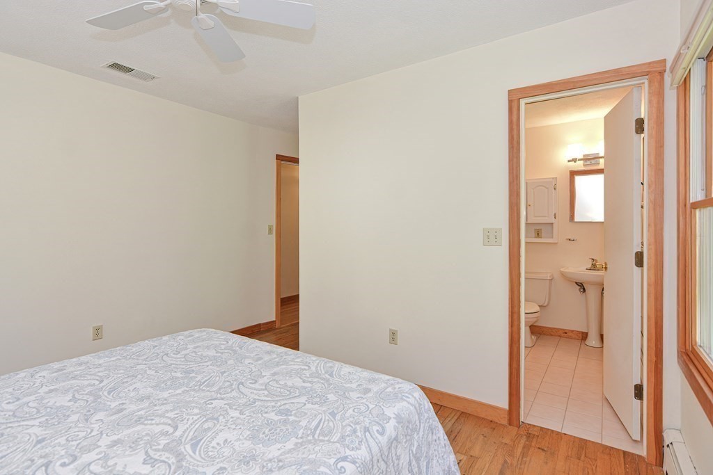 110 Richard Road Holliston, MA 01746 - Photo 31 of 41 a bedroom with a bed and hallway