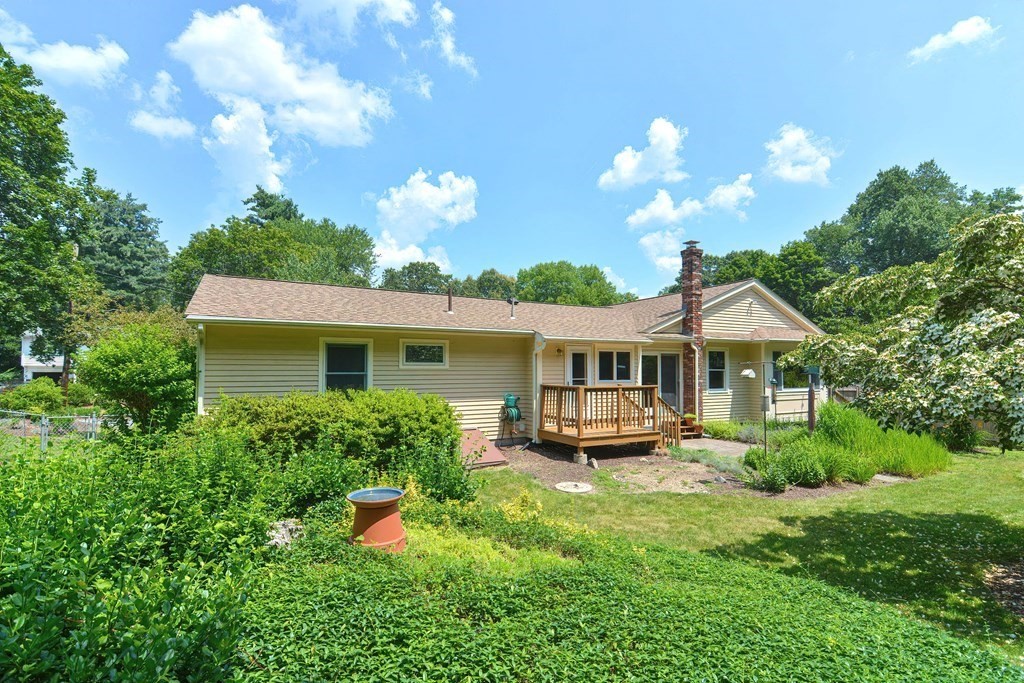 110 Richard Road Holliston, MA 01746 - Photo 4 of 41 a front view of a house with a yard and potted plants