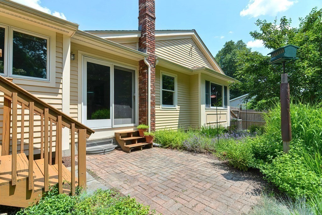 110 Richard Road Holliston, MA 01746 - Photo 5 of 41 a front view of a house with cars parked