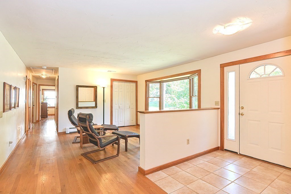 110 Richard Road Holliston, MA 01746 - Photo 10 of 41 a living room with furniture and floor to ceiling windows