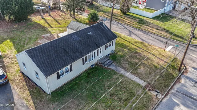 a view of a backyard with sitting area