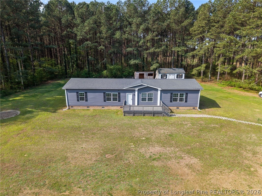 2252 Old Stage Road South Erwin, NC 28339 - Photo 41 of 47 a front view of a house with a garden
