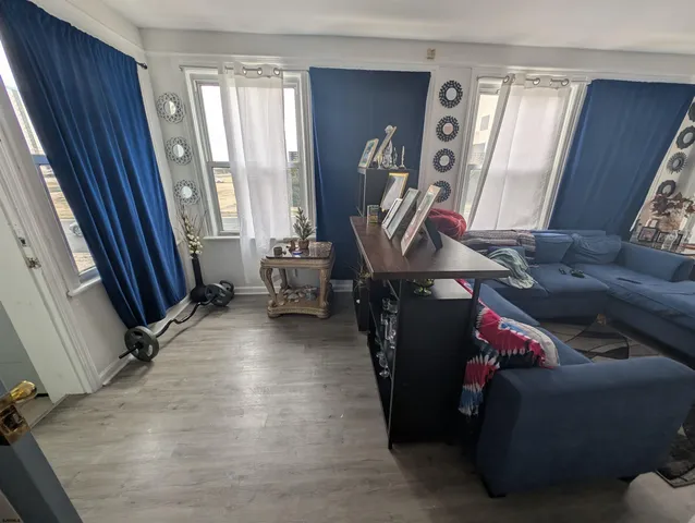 a living room with furniture and a window