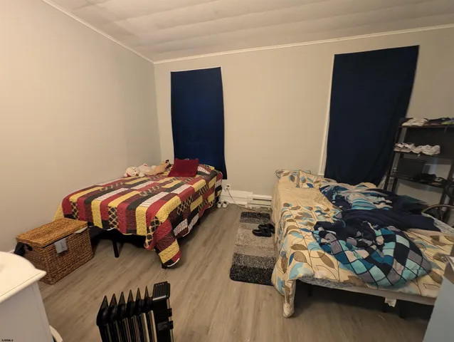 a bedroom with bed and a window