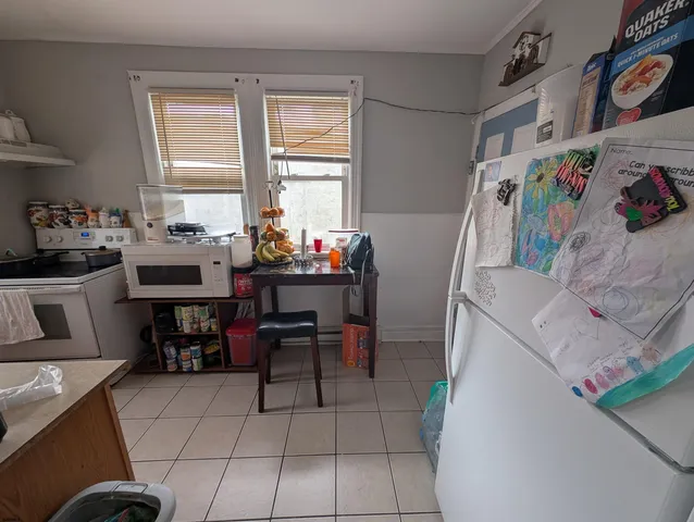 a view of a room with furniture and window