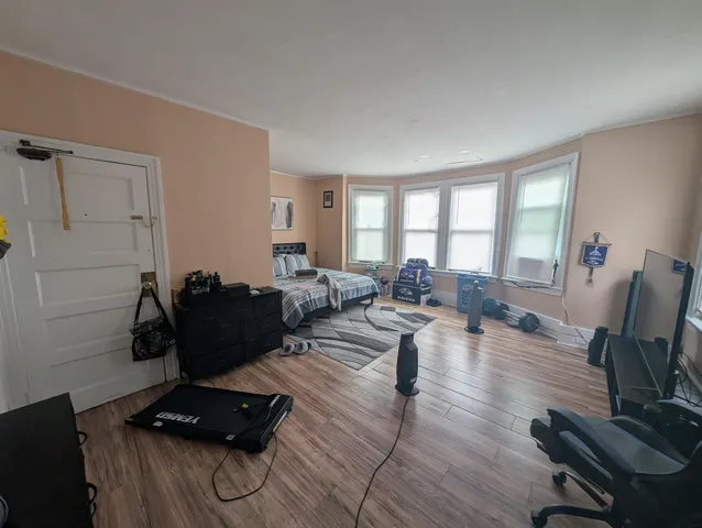 a living room with furniture rug and a window