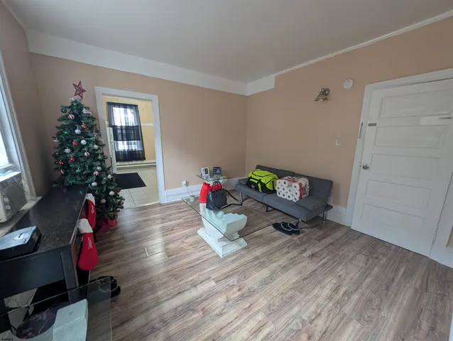 a living room with furniture and flowers